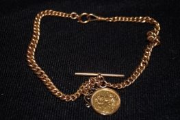 A 9ct gold Albert chain mounted with full sovereign