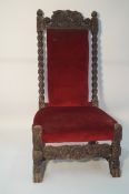 A carved 19th century chair with twist rails and paw supports