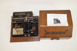 A Mignon cased typewriter