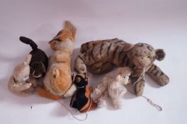 A collection of six various toys including jive bunny, a straw filled tiger, a wind up cat and