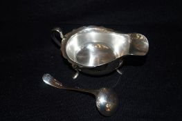 Silver sauce boat and ladle