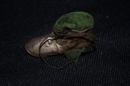 An Edwardian novelty pin cushion in the form of a boot, Birmingham 1906, makers mark worn