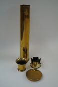 A collection of brass trench art items