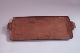 A Newlyn copper tray,with vacant cartouche, stamped to "Newlyn" to the top corner
