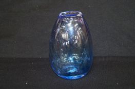 A bulbous glass vase