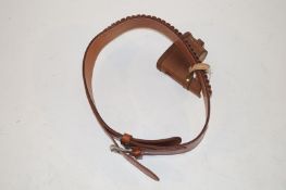 Leather cartridge belt together with a slip on extension