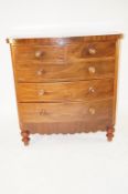 A Victorian bow fronted chest of drawers