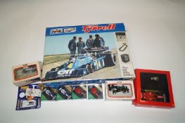 A Polarstill team car in a box, and various other cars