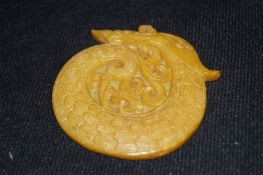A carved jade pendant of a cicada