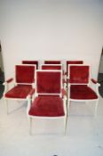 A set of 7 white painted red upholstered armchairs