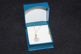 A diamond pendant on 9ct gold chain