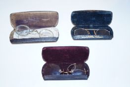 Three pairs of old spectacles