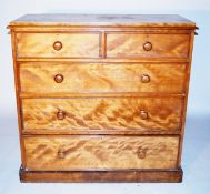 A large chest of drawers, probably satinwood