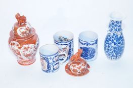 Three large Chinese mugs each decorated with a classical scene and a dragon handle, along with a