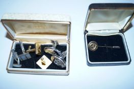 Three sets of cufflinks and a tie pin