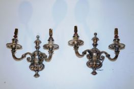A pair of silver plated wall lights