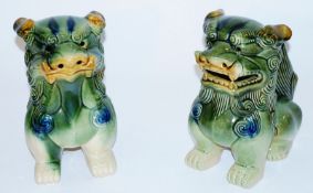 A pair of Chinese dogs along with other oriental ceramics