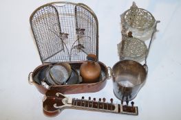 A silver plated ice bucket, along with musical instrument and a collection of brass items