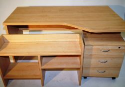 A modern office desk, shelving unit and chest of drawers