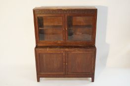 A two section Oak bookcase with glazed doors