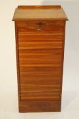 An oak rollfront chest drawer cabinet