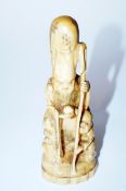A late 19th century carved  figure of a man (PLEASE STATE THIS IS NOT IVORY AS IN CAT)