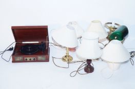A collection of seven lamps and a modern record players