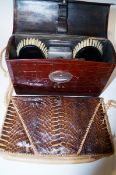 A leather gentleman's vanity case and a snake skin vanity case