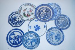 A collection of blue and white plates