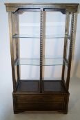 A carved wooden display oriental shelving unit