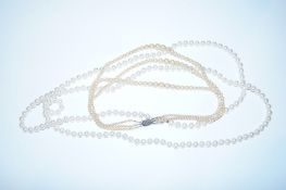 Triple strand faux pearl necklace with silver clasp and one other