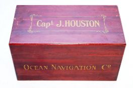 A mahogany box with inscribed Captain J Houston