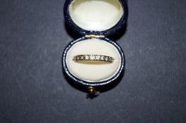 Gold eternity ring, white stones
