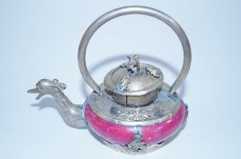 An oriental teapot decorated with dragons and oriental hardstone