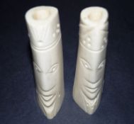 Two carved of bone ornaments