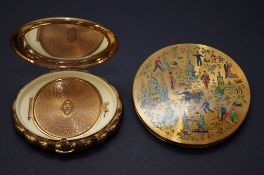 Two powder compacts
