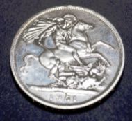A 1951 silver English five shilling coin