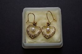 A pair of 9ct Gold earrings