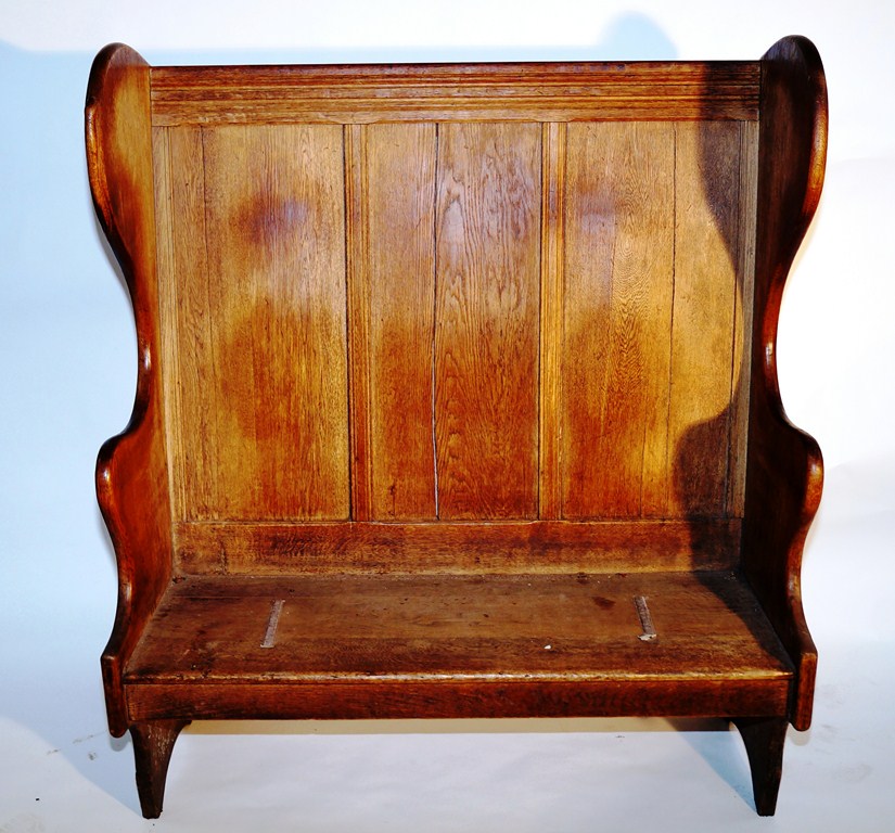 An oak Robert "Mouseman" Thompson apprentice settle, with a carved snake to the top left hand side