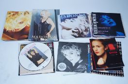 A good collection of Madonna memorabilia to include picture discs, records and tour poster etc.