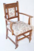 An oak chair with floral upholstery