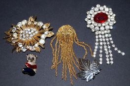 Four costume and one sterling leaf brooches