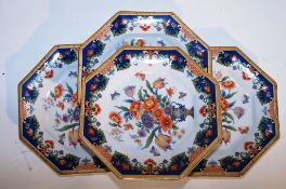 A set of four oriental plates each blue background and gilded decoration