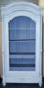 A large single door painted wardrobe with reeded side column