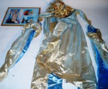 A costume from "Puccini" worn by Julia Migenes, sold along with a photograph display