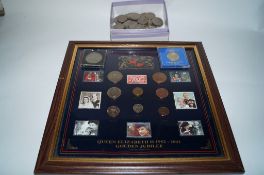A collection of various coins including shillings and 1986 Â£2 commemorative piece and a framed