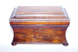 A fine early 19th century  rosewood sarcophagus tea caddy on four bun feet, manufactured by G.C.