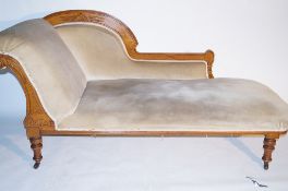 An Edwardian mahogany chaise longue