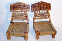A pair of low seating carved chair, each with string weaved seats