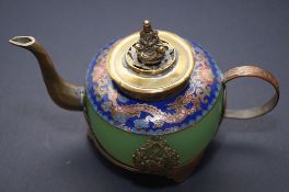 An oriental teapot with enamelled dragon decoration, green stone and four characters to the base